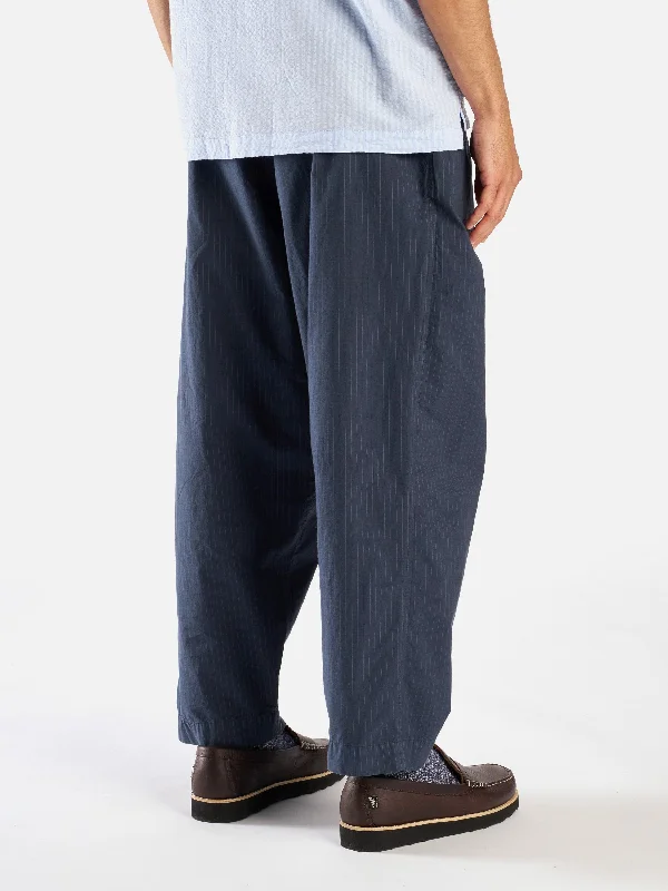 universal-works-pleated-track-pant-in-navy-nearly-pinstripe