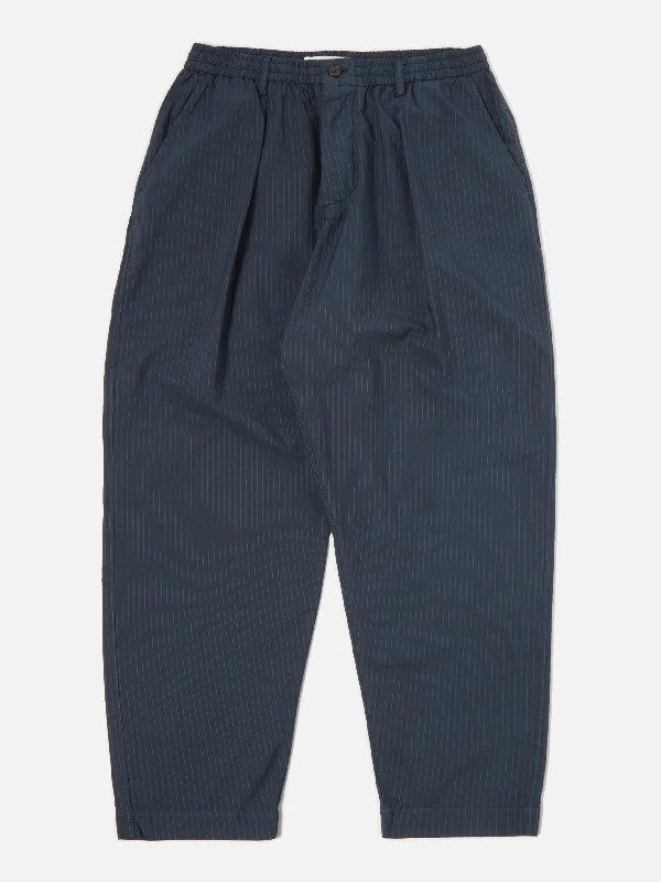 universal-works-pleated-track-pant-in-navy-nearly-pinstripe