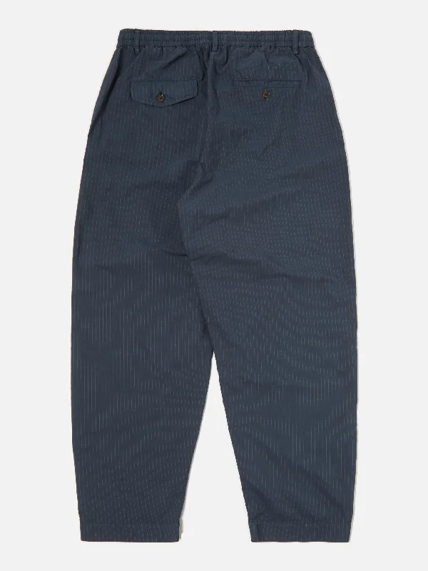 universal-works-pleated-track-pant-in-navy-nearly-pinstripe