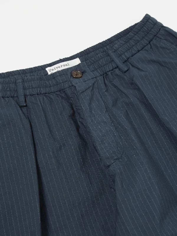 universal-works-pleated-track-pant-in-navy-nearly-pinstripe