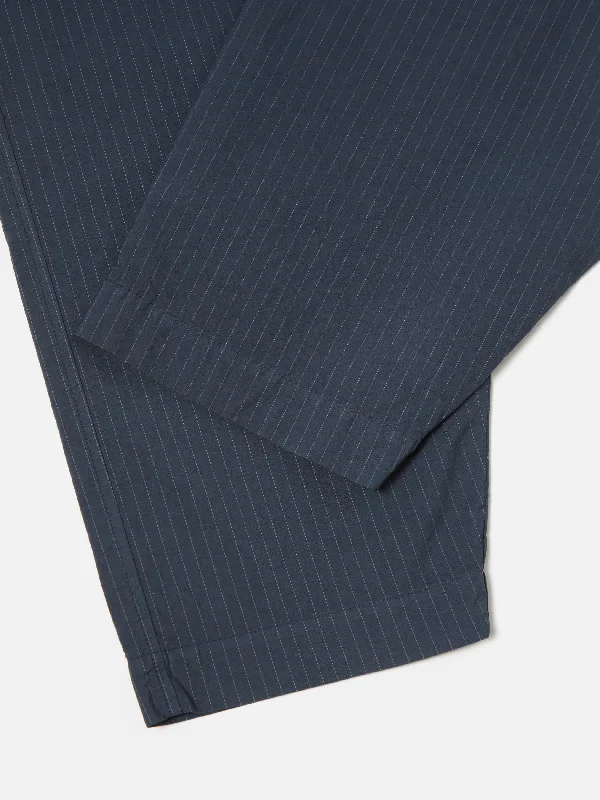 universal-works-pleated-track-pant-in-navy-nearly-pinstripe