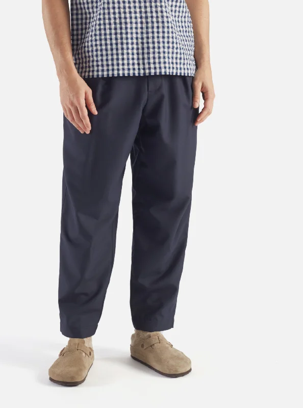 Universal Works Pleated Track Pant in Navy Tropical Suiting