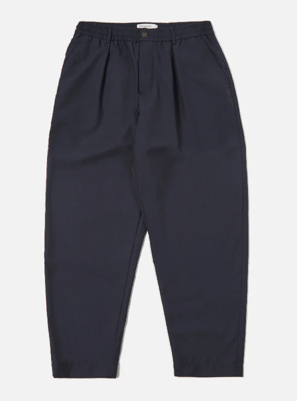 universal-works-pleated-track-pant-in-navy-tropical-suiting