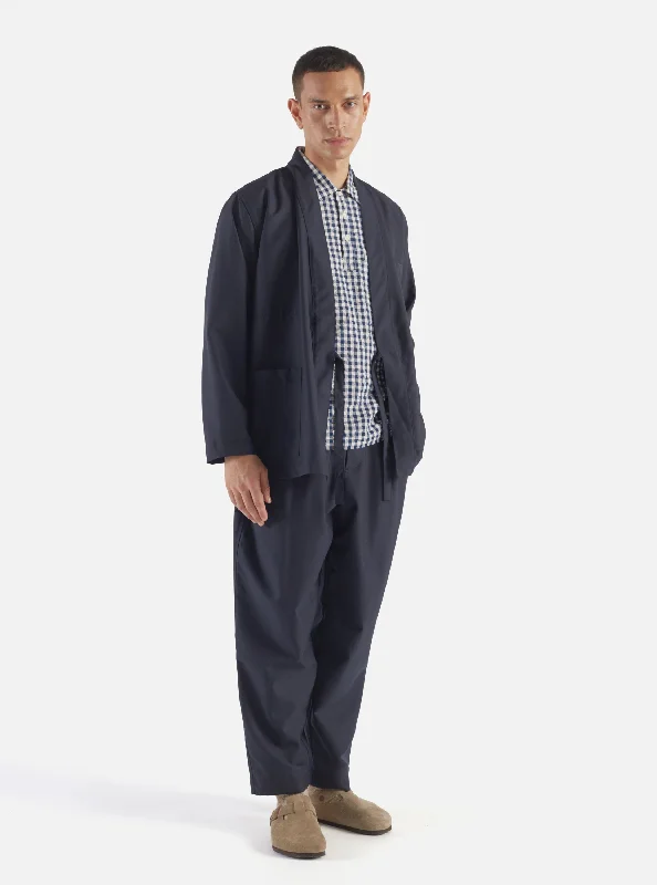 universal-works-pleated-track-pant-in-navy-tropical-suiting